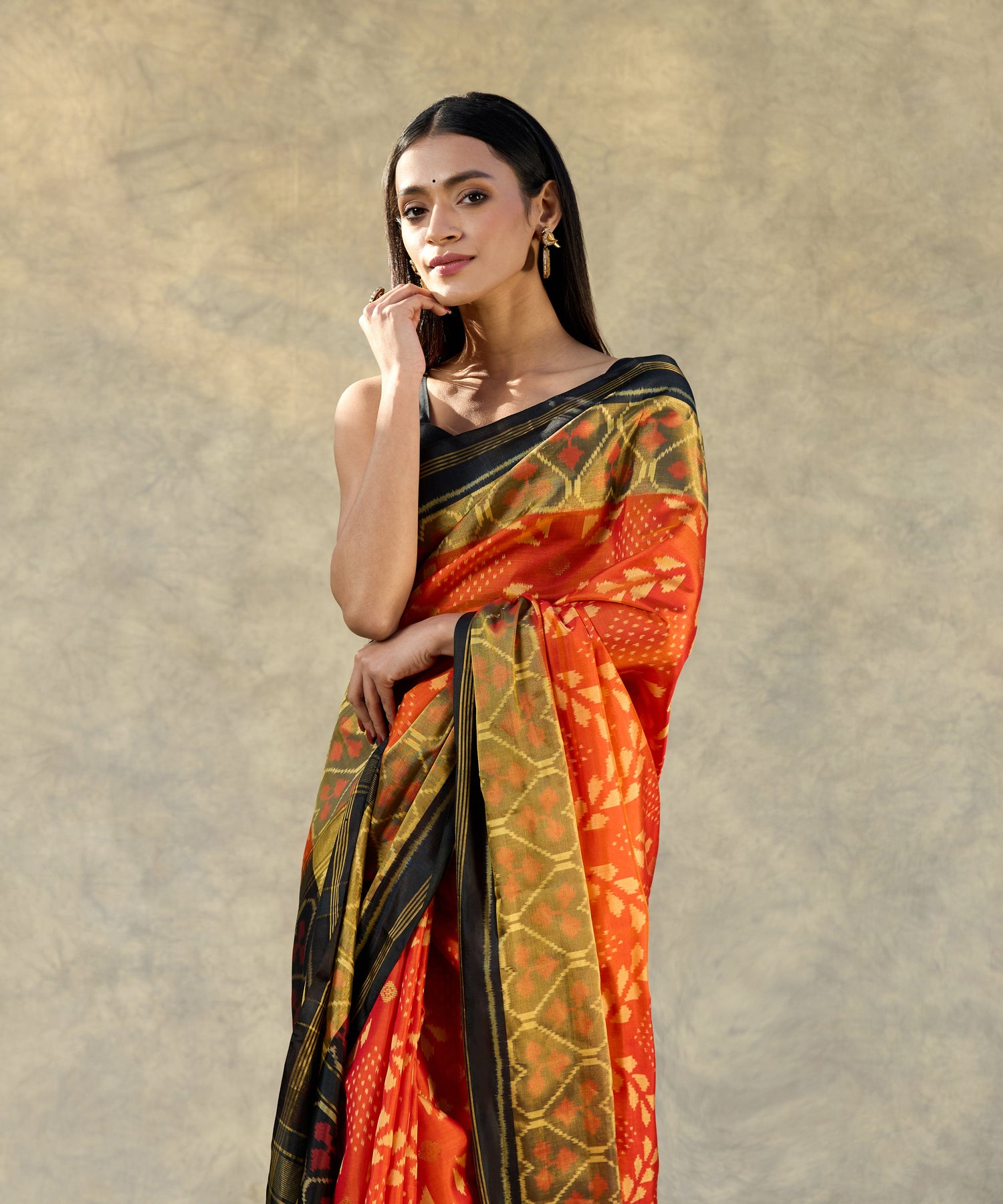 Orange_Handloom_Pure_Mulberry_Silk_Ikat_Patola_Saree_With_Black_Pallu_And_Tissue_Border_WeaverStory_02