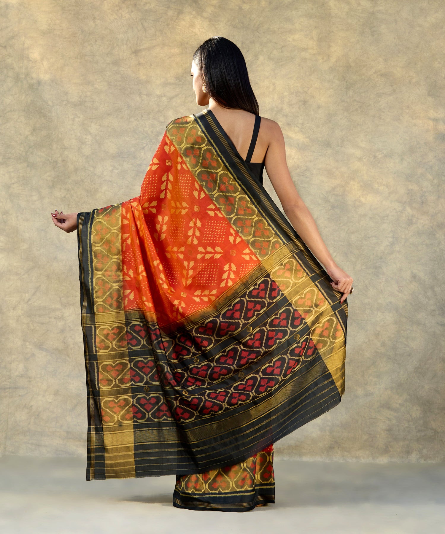 Orange_Handloom_Pure_Mulberry_Silk_Ikat_Patola_Saree_With_Black_Pallu_And_Tissue_Border_WeaverStory_03