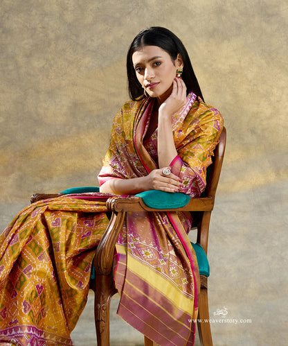 Mustard_And_Purple_Handloom_Pure_Mulberry_Tissue_Silk_Ikat_Patola_Saree_With_Pink_Selvedge_WeaverStory_01