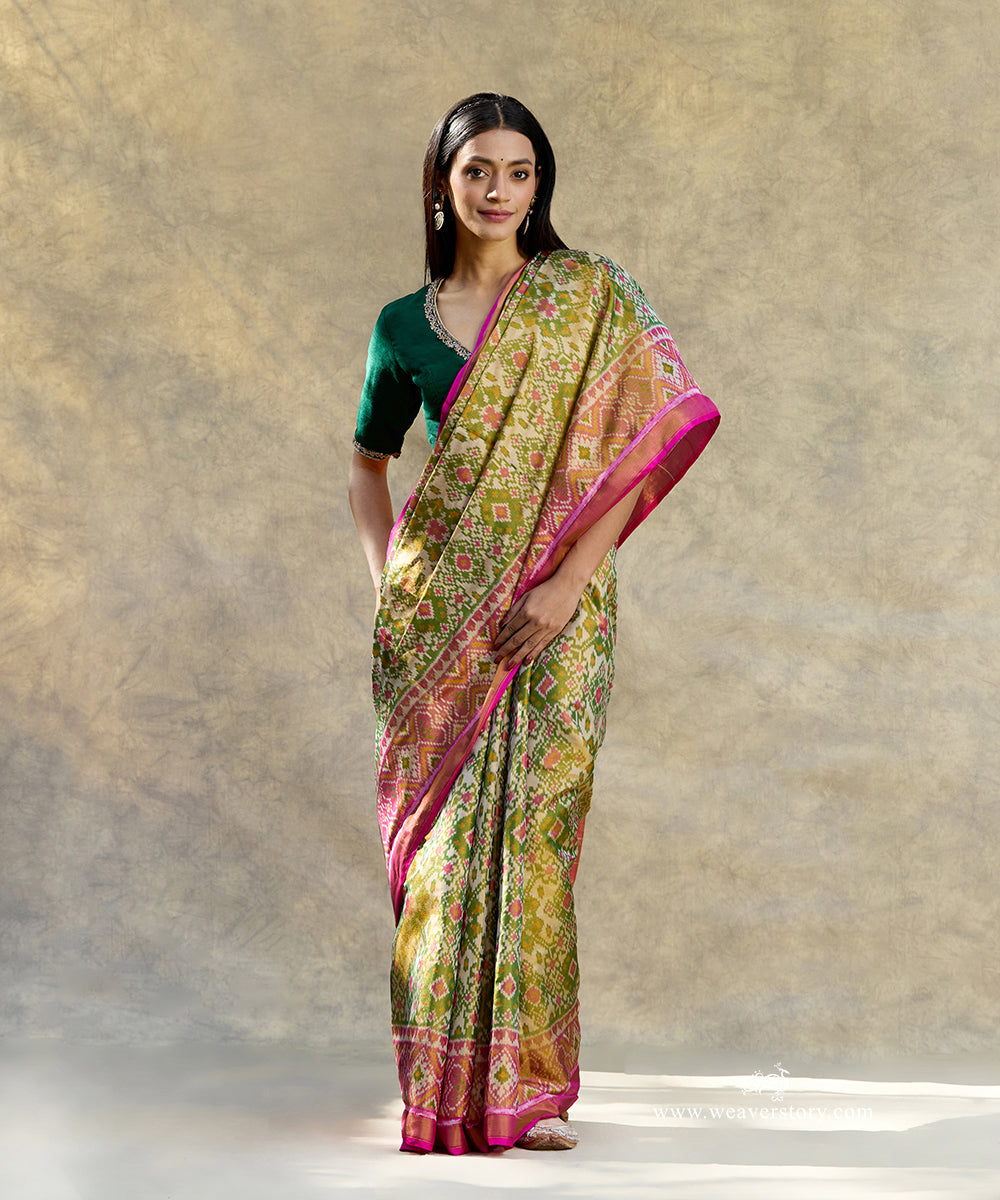 Pink_And_Green_Handloom_Pure_Mulberry_Tissue_Silk_Ikat_Patola_Saree_WeaverStory_01