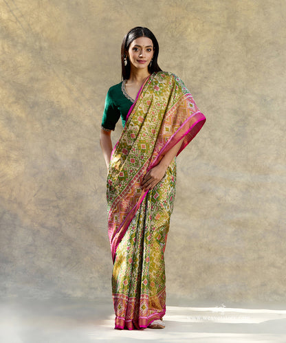 Pink_And_Green_Handloom_Pure_Mulberry_Tissue_Silk_Ikat_Patola_Saree_WeaverStory_01