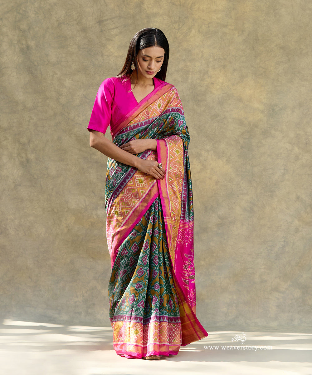 Green_Handloom_Pure_Mulberry_Silk_Ikat_Patola_Saree_With_Pink_Border_Pallu_WeaverStory_01