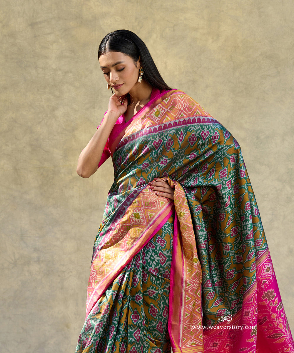 Green_Handloom_Pure_Mulberry_Silk_Ikat_Patola_Saree_With_Pink_Border_Pallu_WeaverStory_02