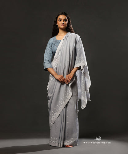 Dusty_Blue_Handloom_Pure_Mulmul_Dhakai_Jamdani_Saree_With_Saffron_Border_WeaverStory_01