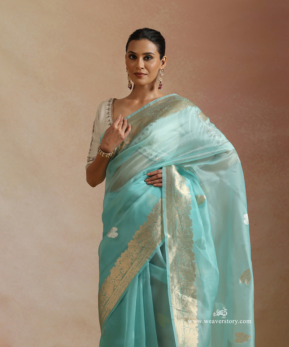 Ice_Blue_Pure_Kora_Silk_Banarasi_Saree_With_Kadhwa_Lotus_Leaf_Boota_With_Gold_Zari_Flower_Bel_WeaverStory_01