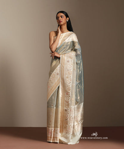 Pastel_Green_And_Baige_Handloom_Pure_Tissu_Silk_Banarasi_Saree_With_Katan_Silk_Kadiyal_Meenakari_Border_And_Gold_Silver_Motifs_WeaverStory_01