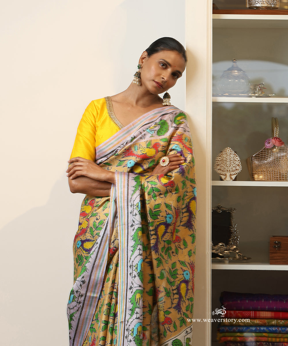 White_And_Green_Handloom_Double_Ikat_Patola_Saree_With_Parrot_Motifs_WeaverStory_01