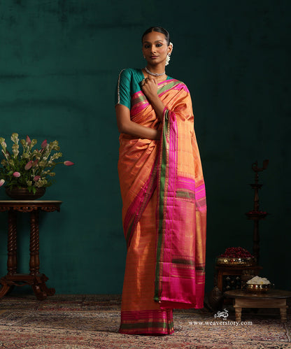 Burnt_Orange_Pure_Silk_Kanjivarm_Saree_With_Zari_Stripes_And_Pink_And_Green_Border_With_Rudraksh_Motifs_WeaverStory_01