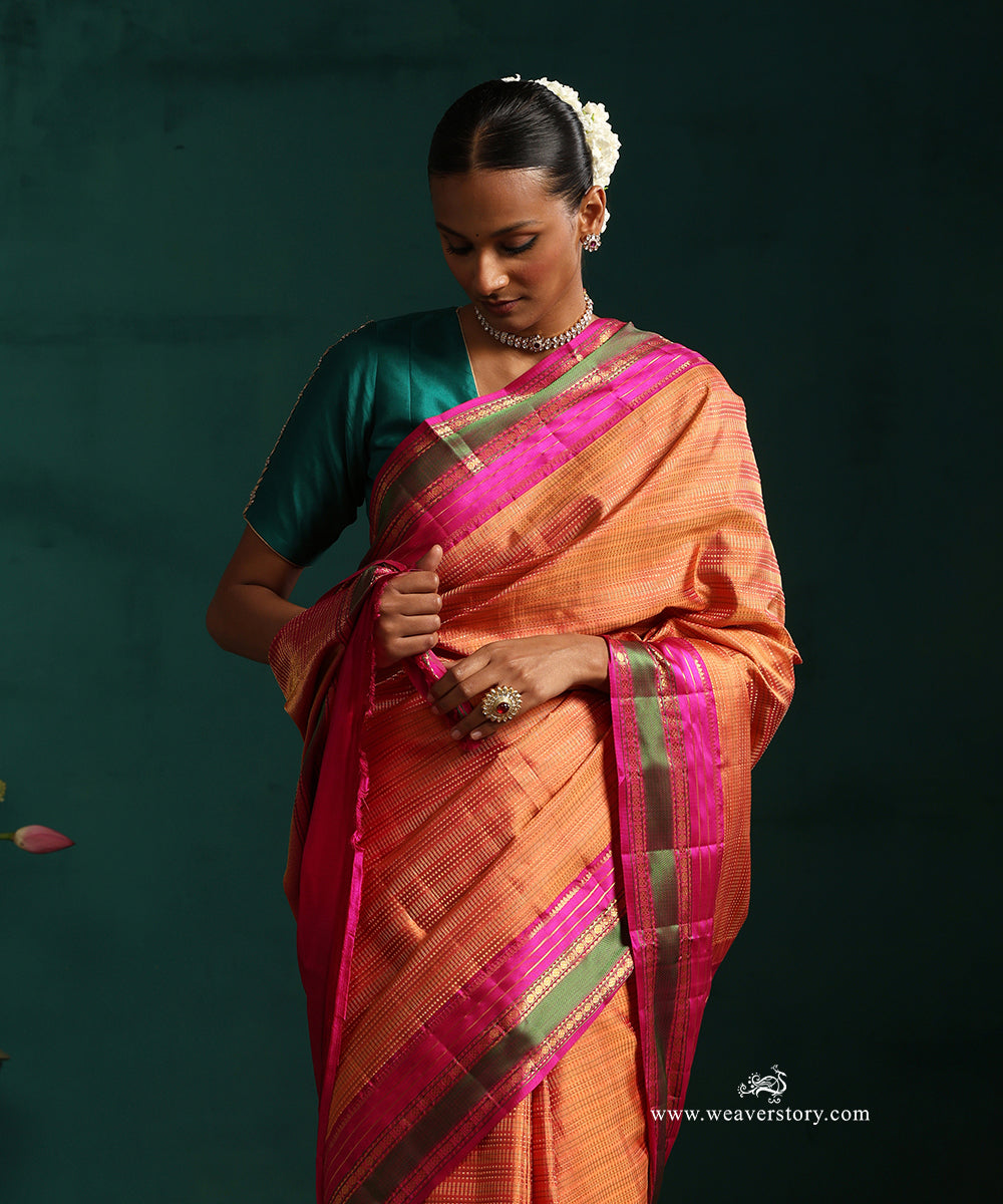 Burnt_Orange_Pure_Silk_Kanjivarm_Saree_With_Zari_Stripes_And_Pink_And_Green_Border_With_Rudraksh_Motifs_WeaverStory_02