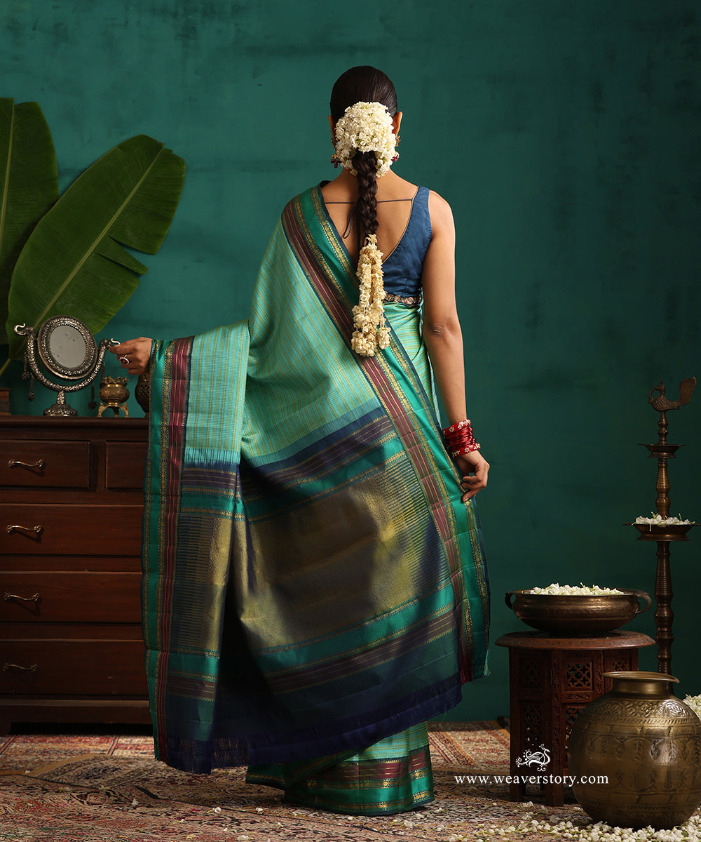 Aqua_Green_Handloom_Pure_Silk_Kanjivaram_Saree_With_All_Over_Zari_Small_Stripes_And_Green_And_Wine_Korwai_Border_WeaverStory_03