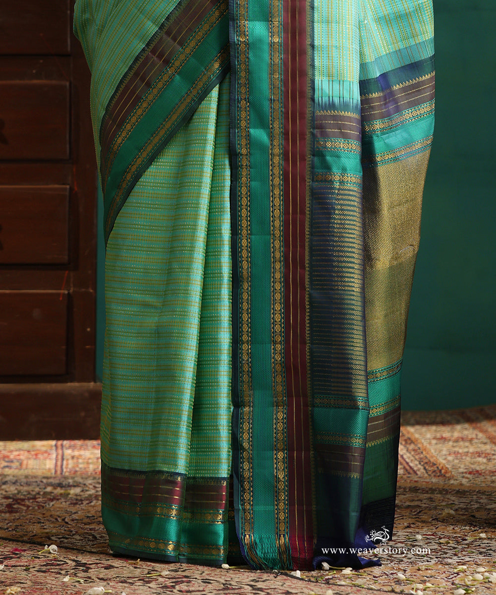 Aqua_Green_Handloom_Pure_Silk_Kanjivaram_Saree_With_All_Over_Zari_Small_Stripes_And_Green_And_Wine_Korwai_Border_WeaverStory_04