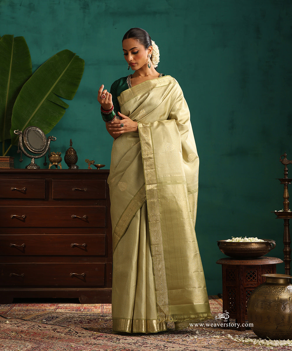 Soft_Green_Handloom_Pure_Silk_Kanjivaram_Saree_With_All_Over_Zari_Weave_And_Sage_Green_Korwai_Border_WeaverStory_01