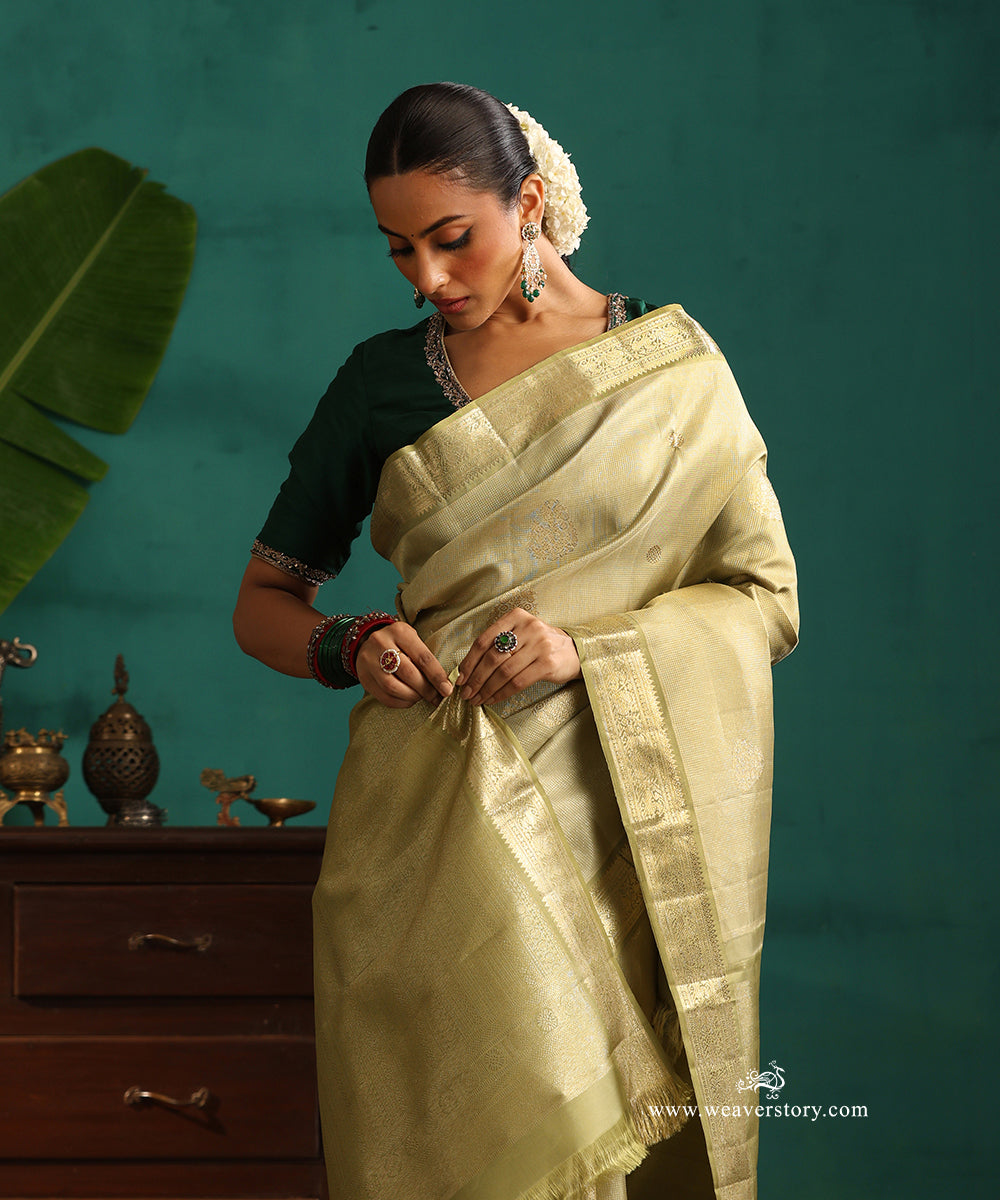 Soft_Green_Handloom_Pure_Silk_Kanjivaram_Saree_With_All_Over_Zari_Weave_And_Sage_Green_Korwai_Border_WeaverStory_02