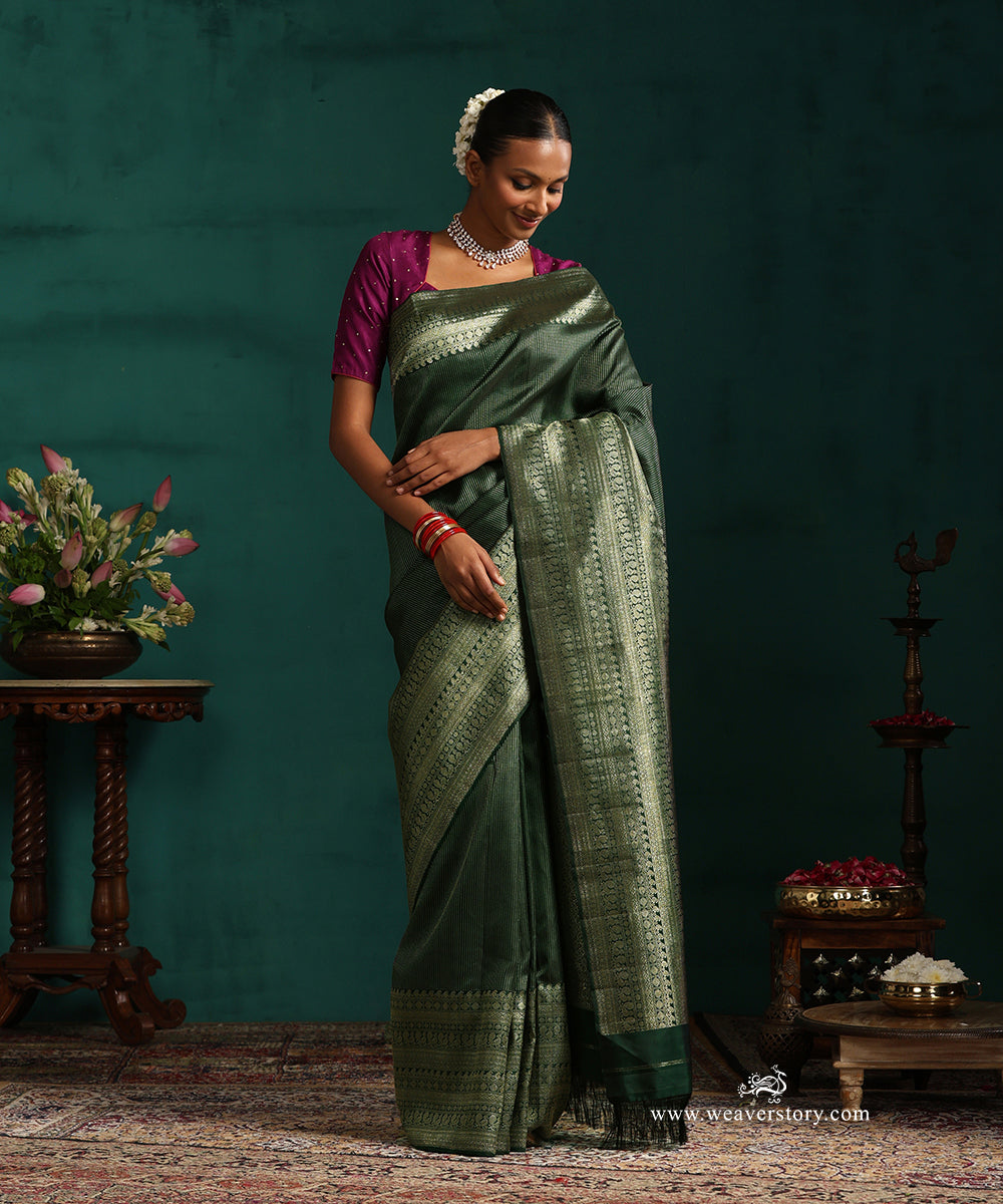 Bottle_Green_Pure_Silk_Kanjivaram_Saree_With_Antique_Silver_Zari_Stripes_And_Paisley_And_Annapakshi_Border_WeaverStory_01