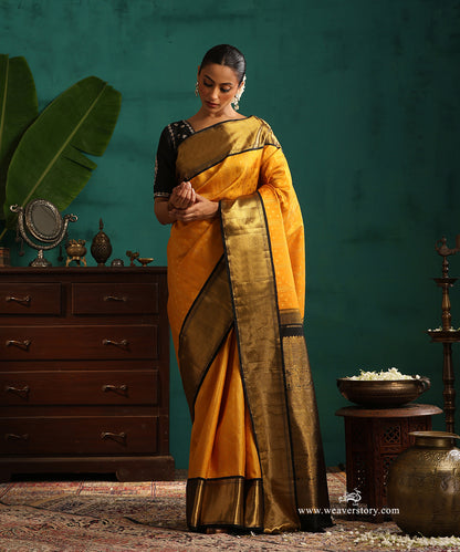 Turmeric Yellow Pure Silk Pure Zari Kanjivaram Saree With Rudraksh And Annapakshi Motifs And Black Korwai Border