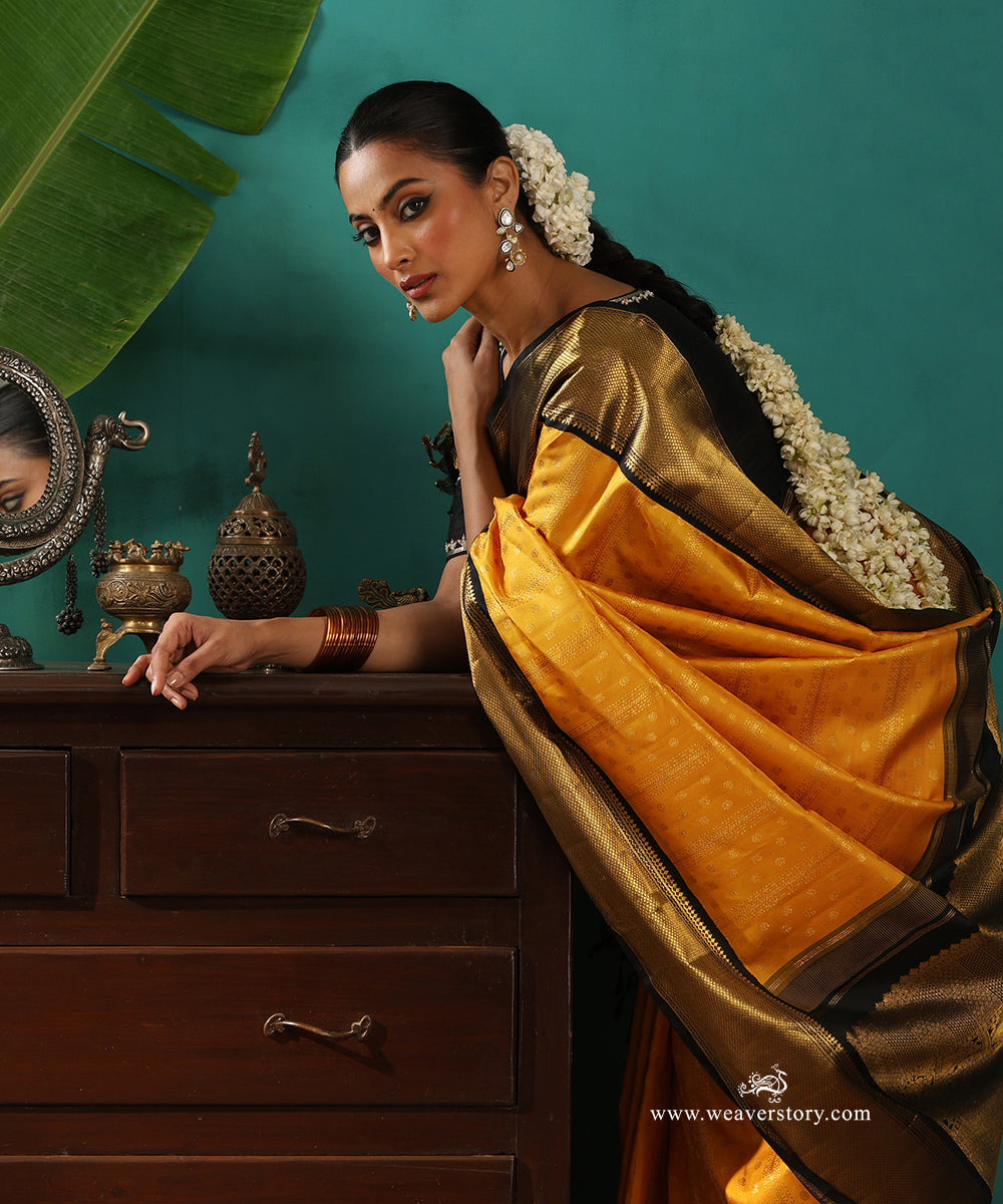 Turmeric Yellow Pure Silk Pure Zari Kanjivaram Saree With Rudraksh And Annapakshi Motifs And Black Korwai Border