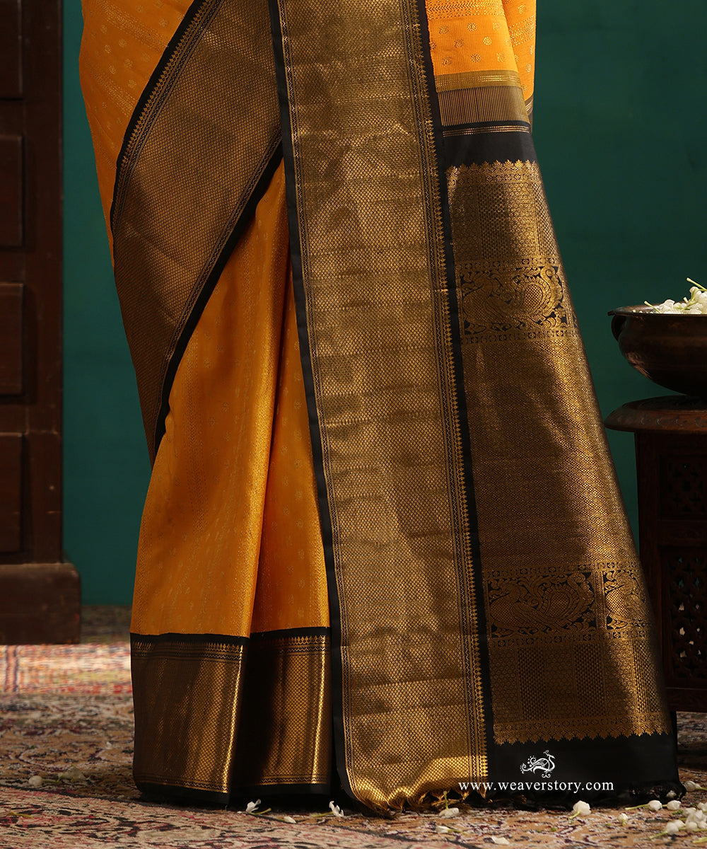 Turmeric Yellow Pure Silk Pure Zari Kanjivaram Saree With Rudraksh And Annapakshi Motifs And Black Korwai Border