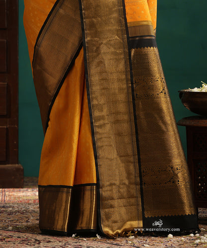 Turmeric Yellow Pure Silk Pure Zari Kanjivaram Saree With Rudraksh And Annapakshi Motifs And Black Korwai Border