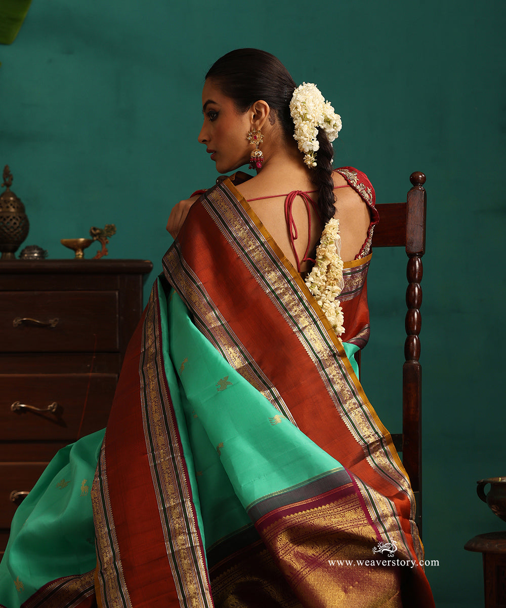 Aqua_Green_Handloom_Pure_Silk_Kanjivaram_Silk_Saree_With_Deer_Motifs_And_Rust_Korwai_Border_WeaverStory_02