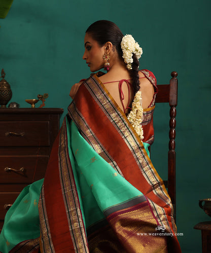 Aqua_Green_Handloom_Pure_Silk_Kanjivaram_Silk_Saree_With_Deer_Motifs_And_Rust_Korwai_Border_WeaverStory_02