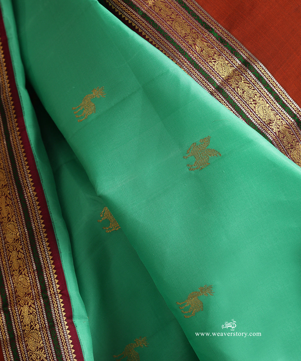 Aqua_Green_Handloom_Pure_Silk_Kanjivaram_Silk_Saree_With_Deer_Motifs_And_Rust_Korwai_Border_WeaverStory_05