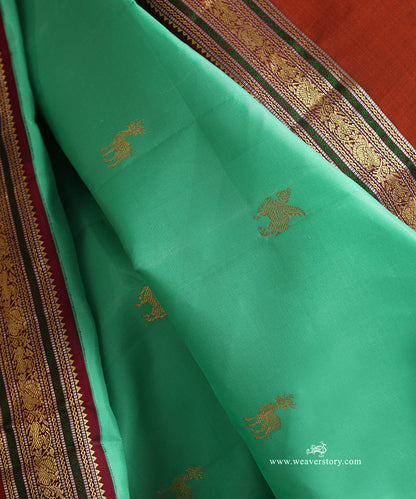 Aqua_Green_Handloom_Pure_Silk_Kanjivaram_Silk_Saree_With_Deer_Motifs_And_Rust_Korwai_Border_WeaverStory_05