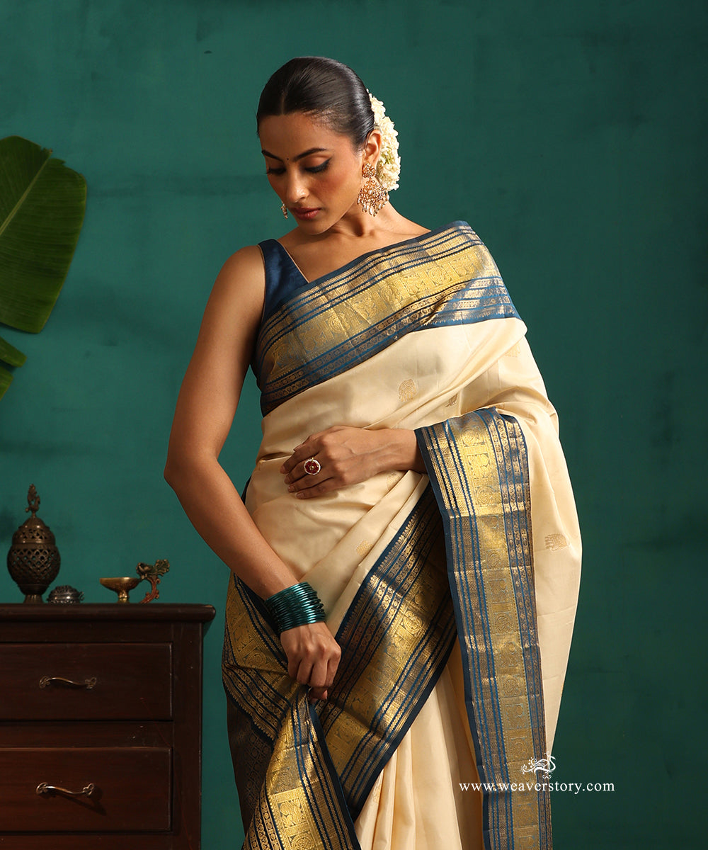 Cream_Handloom_Pure_Silk_Pure_Zari_Kanjivaram_Saree_With_Elephant_Motifs_And_Blue_Korwai_Border_WeaverStory_02