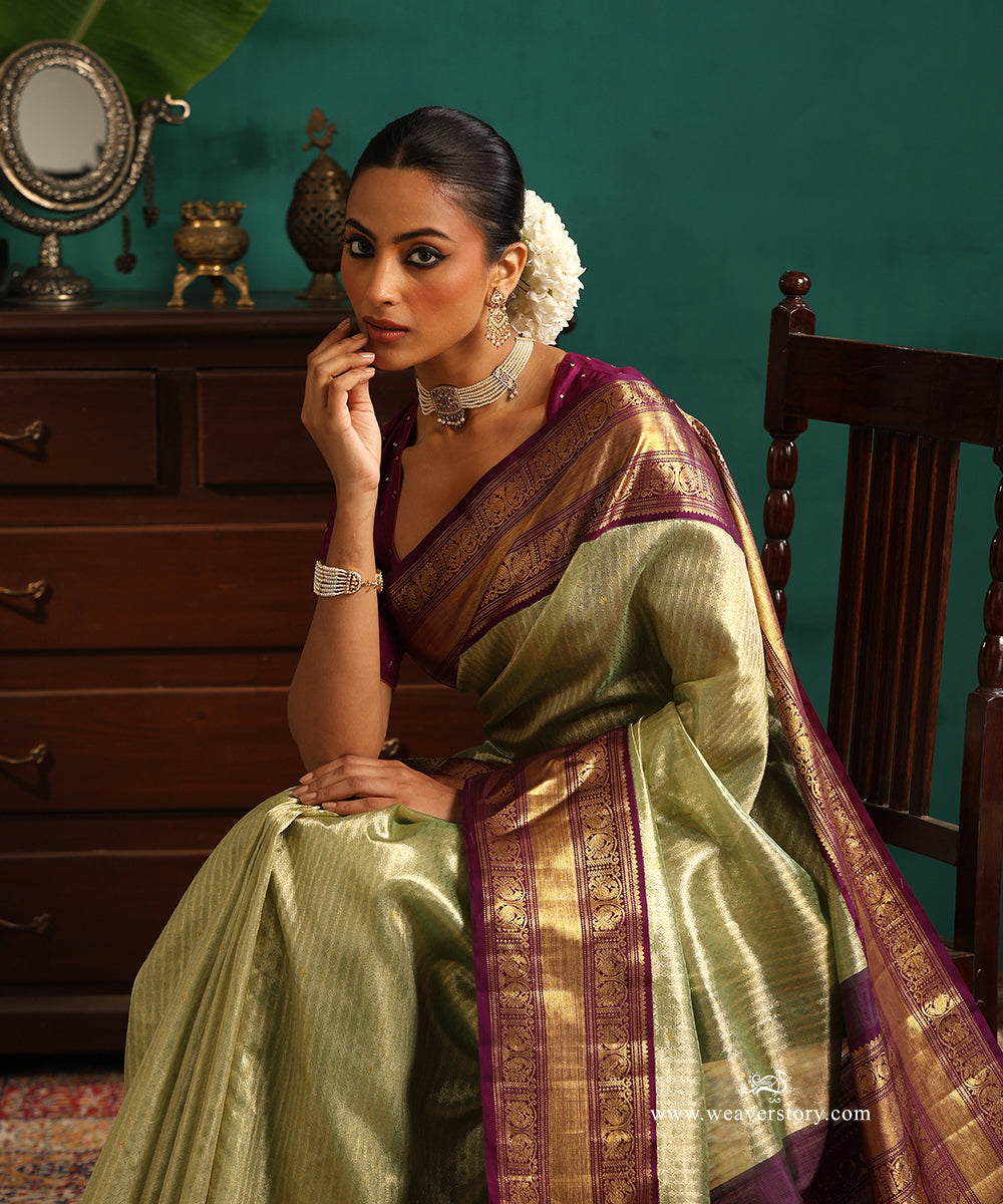 Pastel_Green_And_Gold_Handloom_Pure_Silk_Tissue_Kanjivaram_Saree_With_Purple_Korwai_Annapakshi_Border_WeaverStory_02