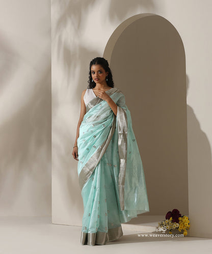 Ice_Blue_Handloom_Pure_Silk_Chanderi_Eknaliya_Saree_With_Blue_Meena_Small_Booti_And_Silver_Zari_Saffron_Border_WeaverStory_01