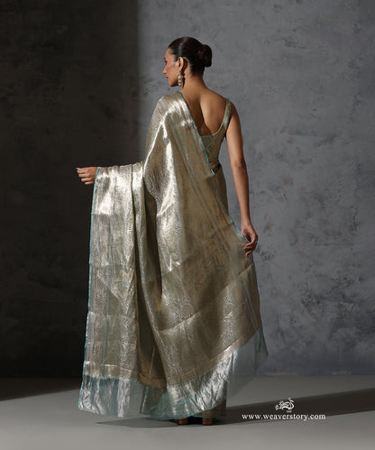 Back view showing the Tanchoi pallu, zari border and mint green edge of the Banarasi tissue saree