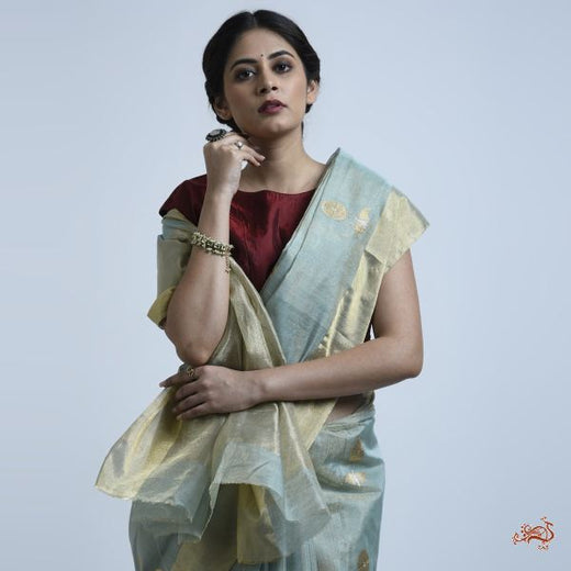 Aqua and gold silk tissue saree