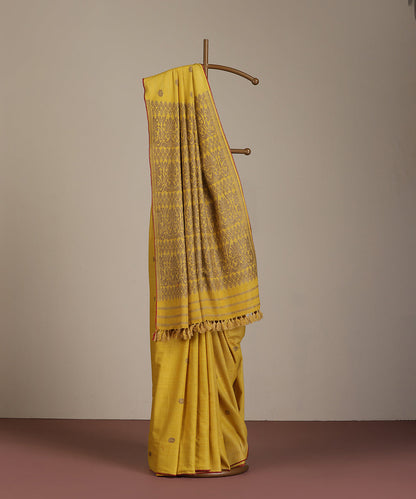Yellow_Handloom_Pure_Eri_Silk_Turmeric_Dye_Saree_With_Red_Selvedge_WeaverStory_01