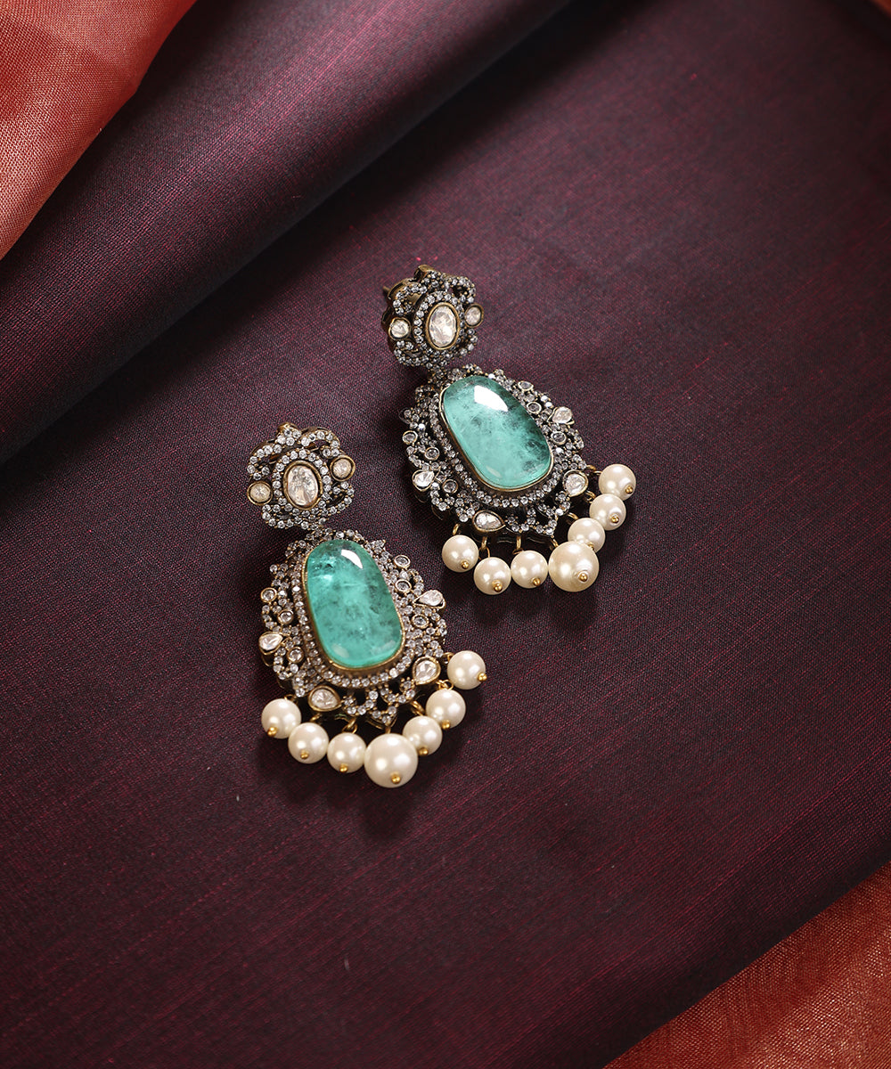 Dhanyasri_Handcrafted_Silver_Alloy_Earrings_With_Blue_Semi_Precious_Stones_WeaverStory_01