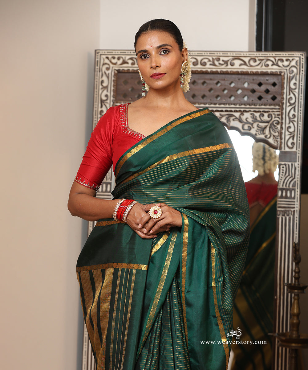 Bottle Green Handloom Pure Silk Kanjivaram Saree With Allover Horizontal Golden Zari Lines And Golden Border