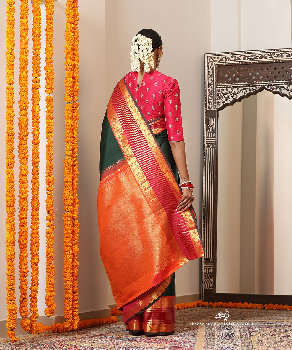 Bottle Green Plain Handloom Pure Silk Kanjivaram Saree With Annapakshi Motifs On Peach Pink Border