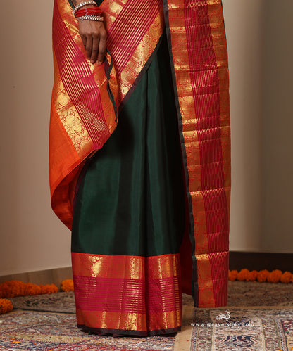 Bottle Green Plain Handloom Pure Silk Kanjivaram Saree With Annapakshi Motifs On Peach Pink Border