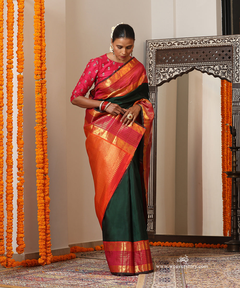 Bottle Green Plain Handloom Pure Silk Kanjivaram Saree With Annapakshi Motifs On Peach Pink Border
