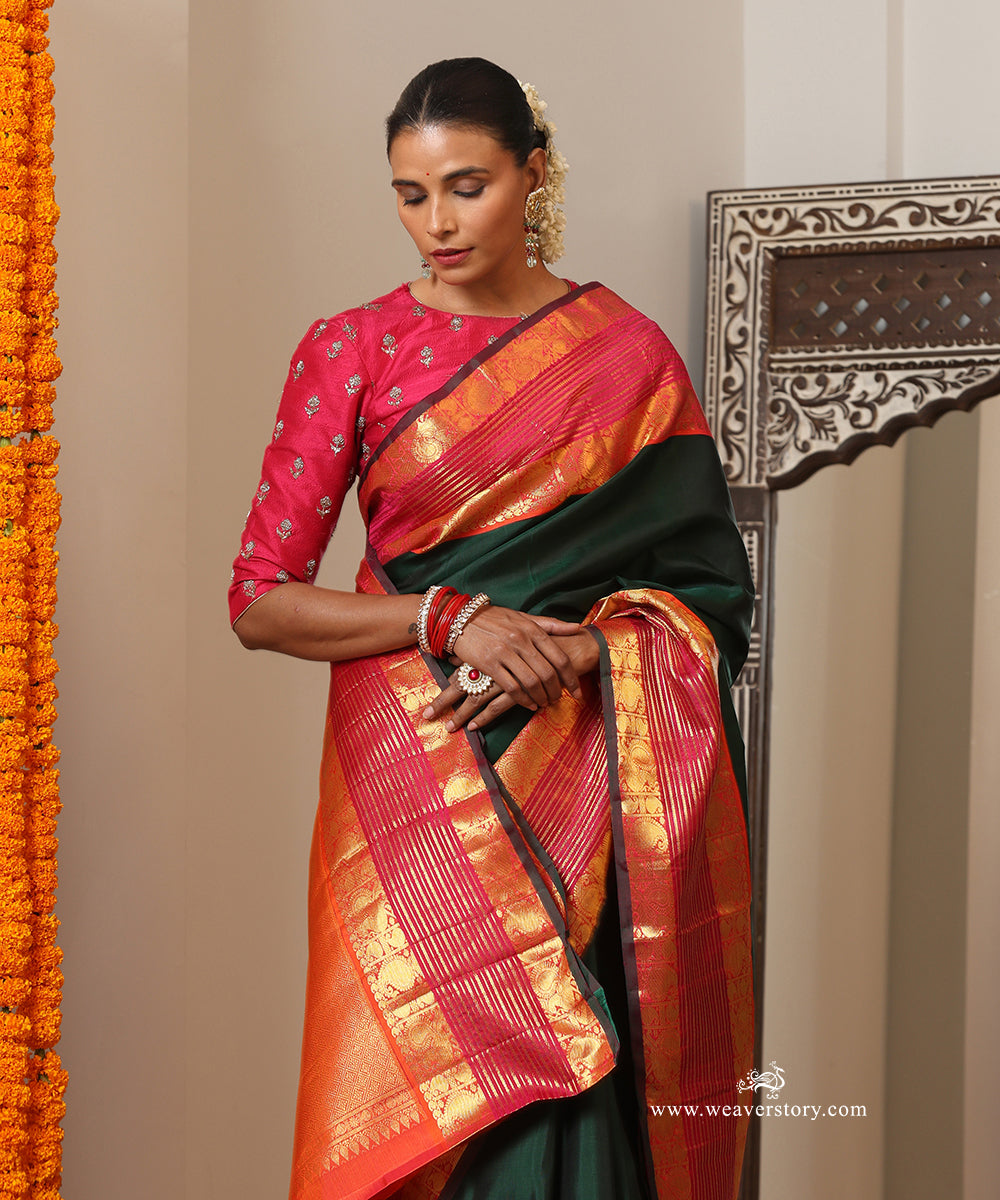Bottle Green Plain Handloom Pure Silk Kanjivaram Saree With Annapakshi Motifs On Peach Pink Border