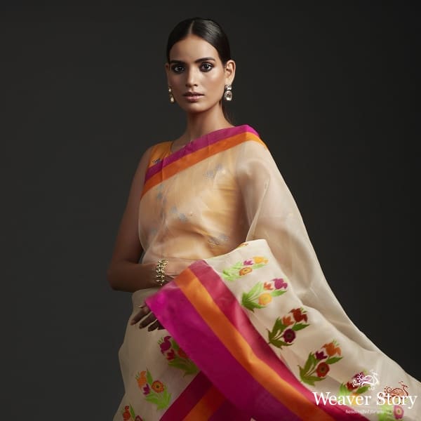 Cream_kora_by_kora_saree_with_heavy_multicolor_border_and_floral_motifs_WeaverStory_01