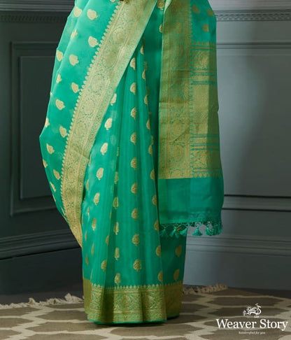 Green_banarasi_kora_saree_with_beldar_border_and_kairi_boota_WeaverStory_04