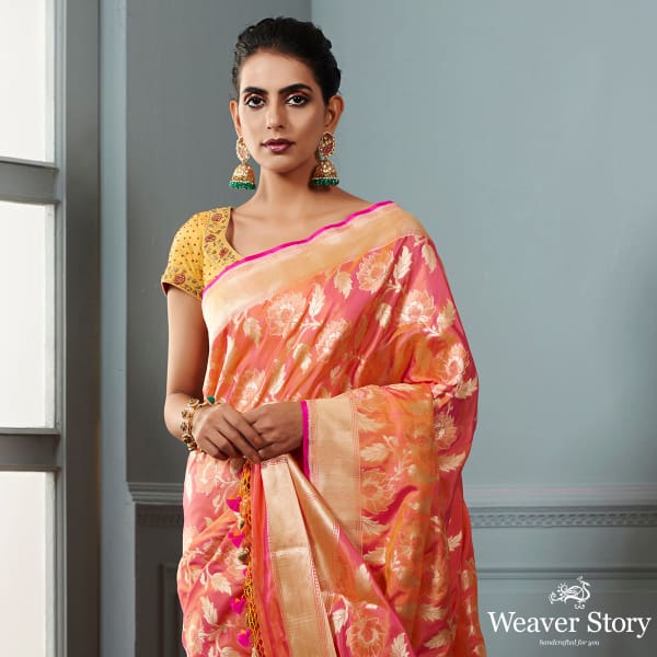 Handwoven_Banarasi_saree_in_Oramge_and_peach_dual_tone_with_floral_jaal_WeaverStory_01