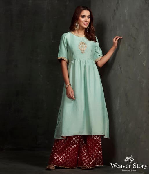 Hand_front_boota_embroidered_munga_silk_suit_in_light_blue_color_with_brocade_palazzo_WeaverStory_01