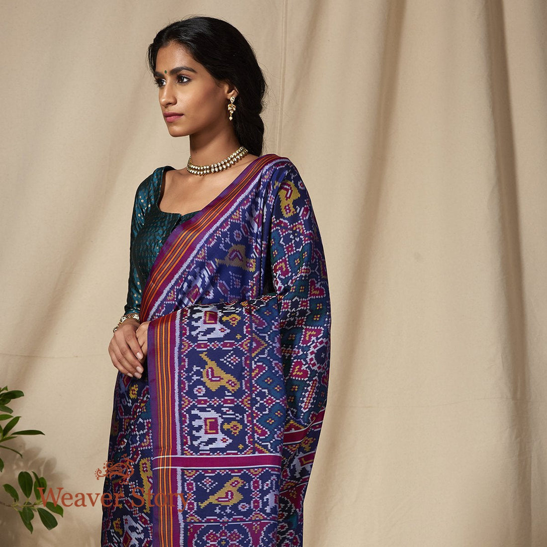 Handwoven_Blue_and_Teal_Dual_Tone_Gujarat_Patola_Saree_with_Purple_Border_WeaverStory_01