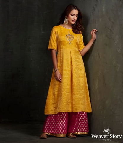 Hand_embroidered_munga_silk_suit_in_mustard_color_with_brocade_palazzo_WeaverStory_01