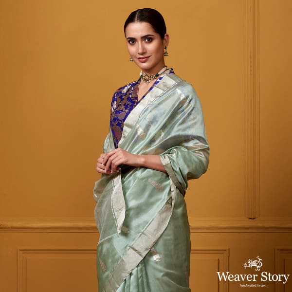 Handwoven_Light_Green_Silver_Zari_Motif_Silk_Saree_WeaverStory_01