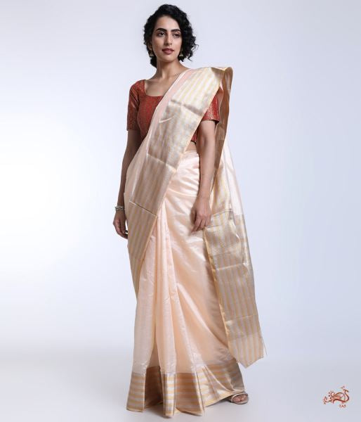 Handwoven_Peach_Chanderi_silk_saree_with_a_Gold_and_Silver_border_WeaverStory_02