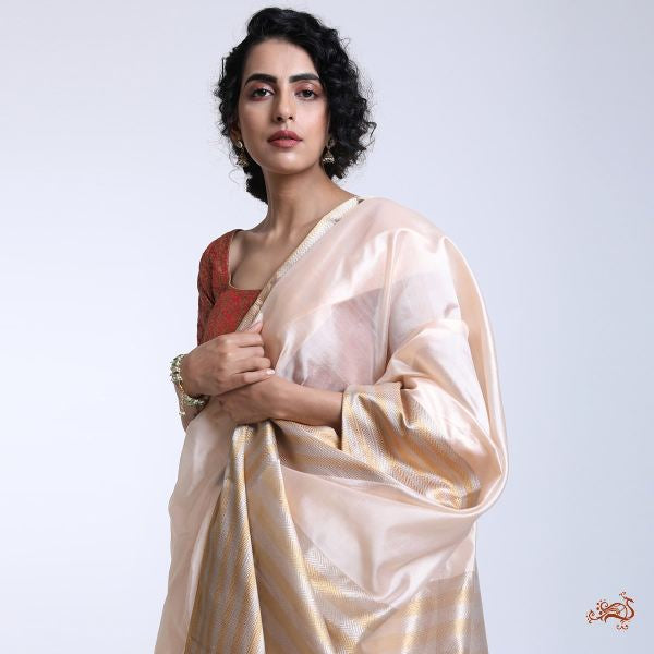 Handwoven_Peach_Chanderi_silk_saree_with_a_Gold_and_Silver_border_WeaverStory_01
