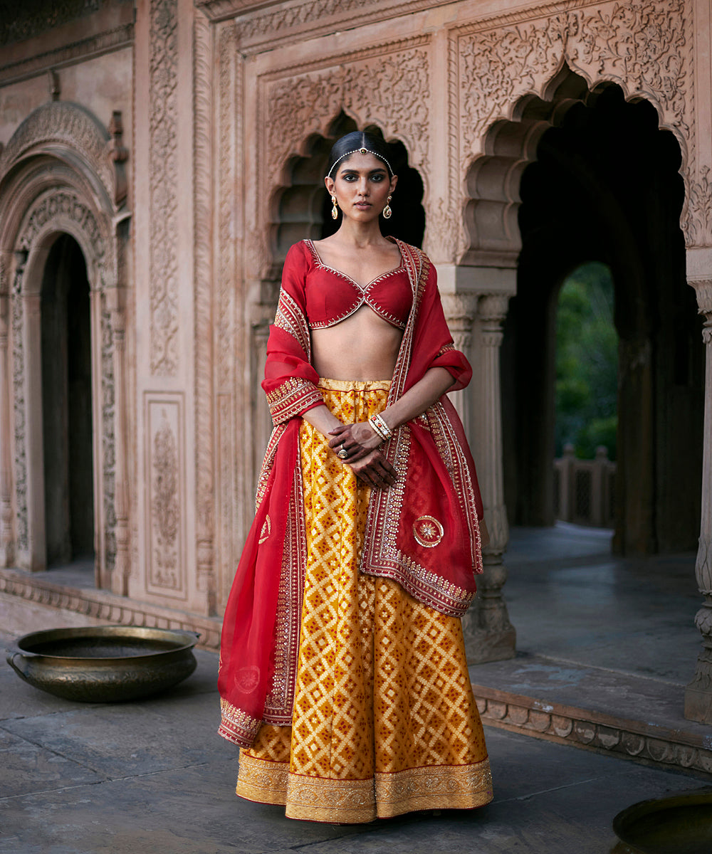 Yellow_Georgette_Banarasi_Bandhej_Lehenga_With_Red_Blouse_And_Dupatta_And_Yellow_Belt_WeaverStory_01