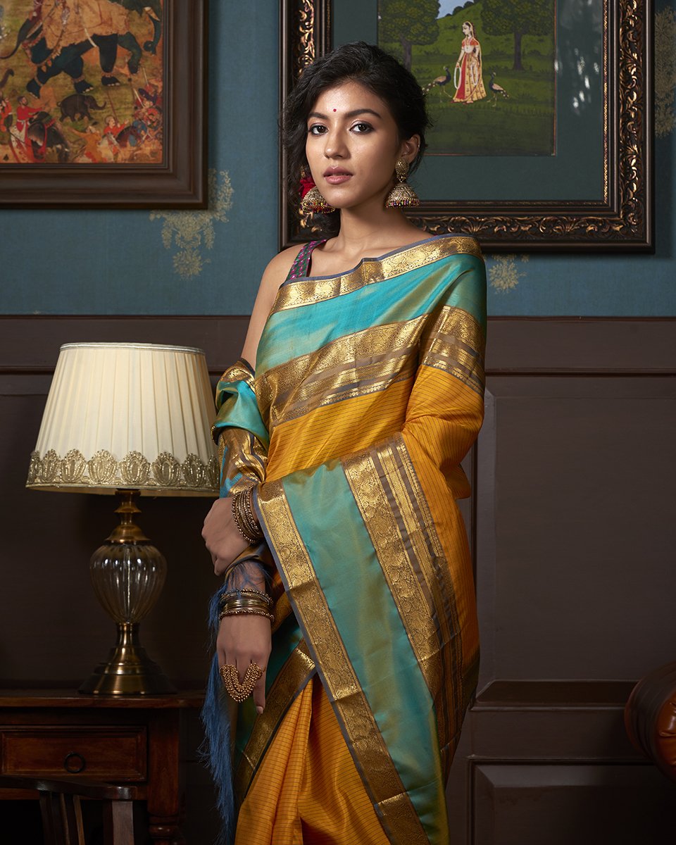 Handloom_Mustard_Striped_Kanjivaram_Silk_Saree_With_Grey_And_Green_Border_WeaverStory_01