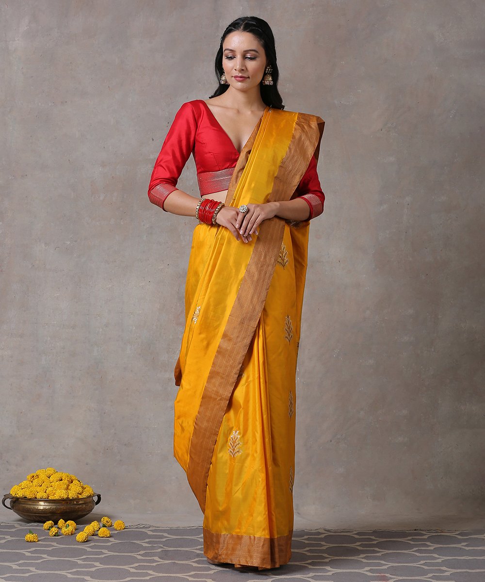 Handloom_Yellow_Pure_Katan_Silk_Banarasi_Saree_With_Antique_Zari_Border_and_Leaf_motifs_WeaverStory_01